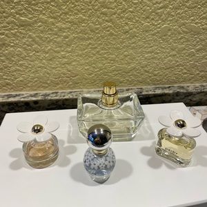 Versace  Yellow Diamond perfume (half full) and 3 Daisy perfumes travel size